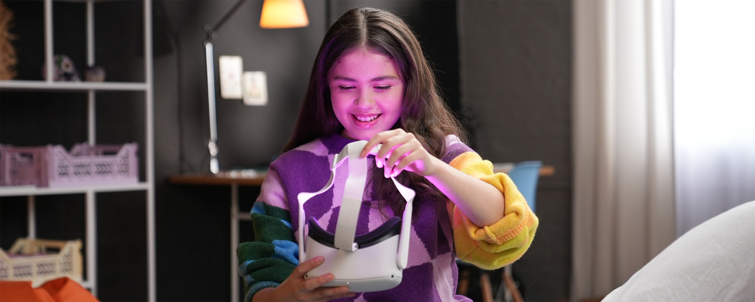 Young woman putting on VR goggles