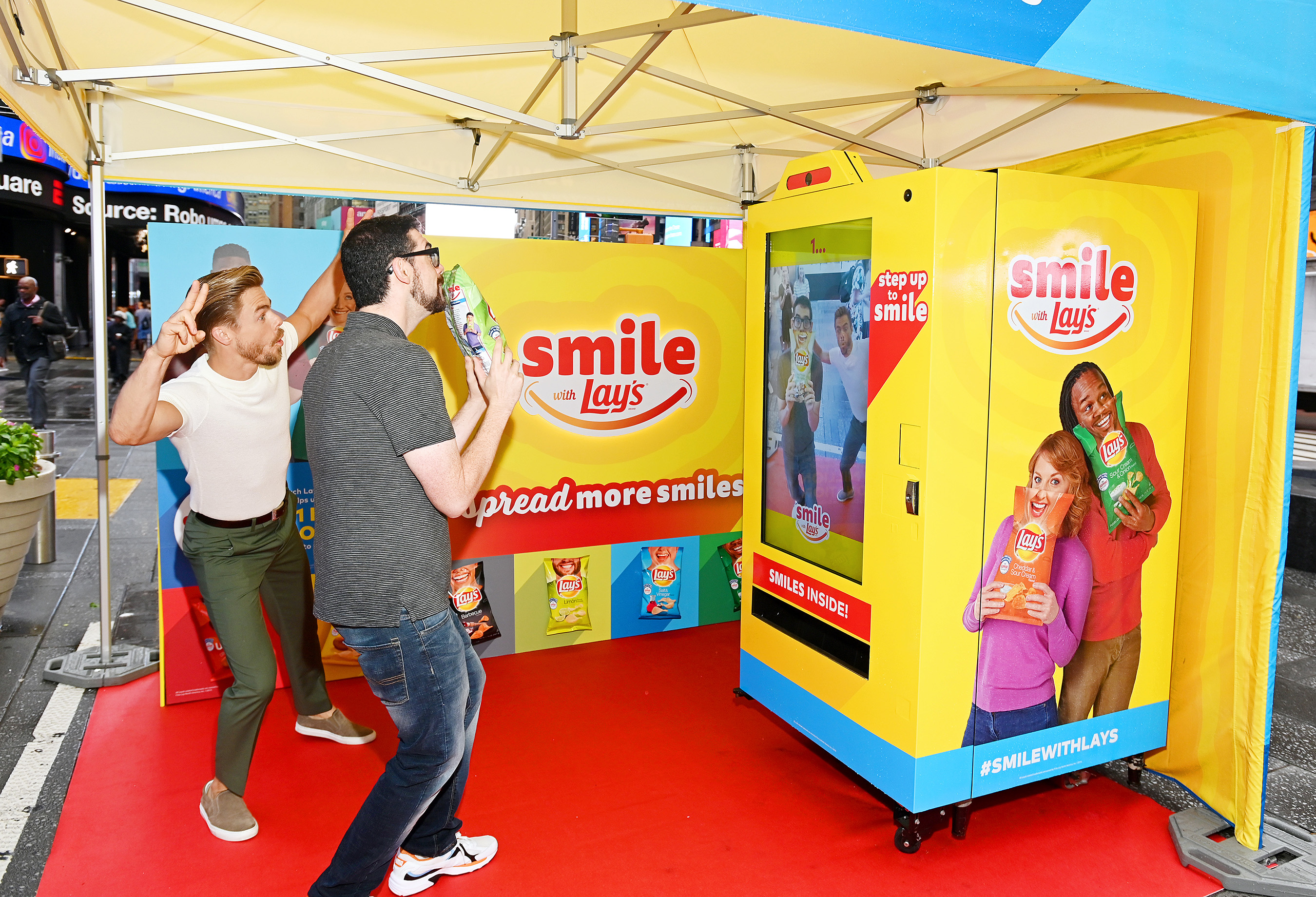 Dancer, actor and singer Derek Hough kicks off the Lay’s Smiles campaign by unveiling the first-ever Smiles Station in Times Square, New York City, on July 23, 2019. The station dispenses Lay’s limited-edition bags to passerby featuring real people’s stories and smiles aimed at helping raise $1 million to Operation Smile.